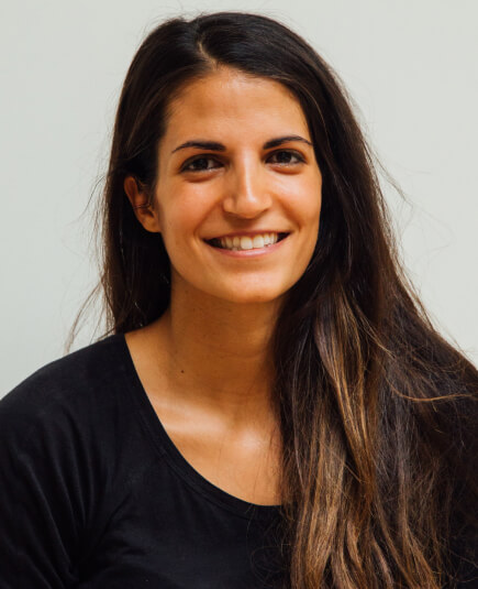 a smiling woman wearing black shirt